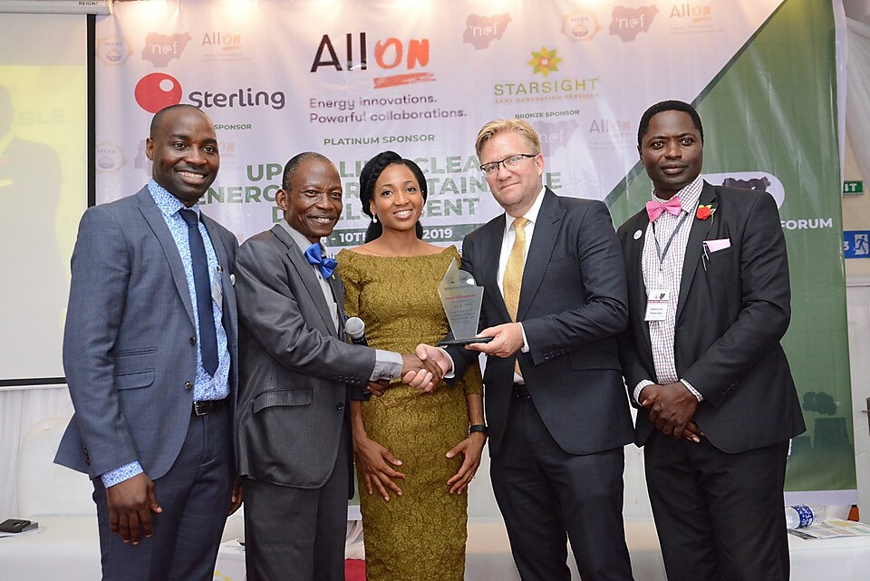 All On receives a recognition award from the NEF team