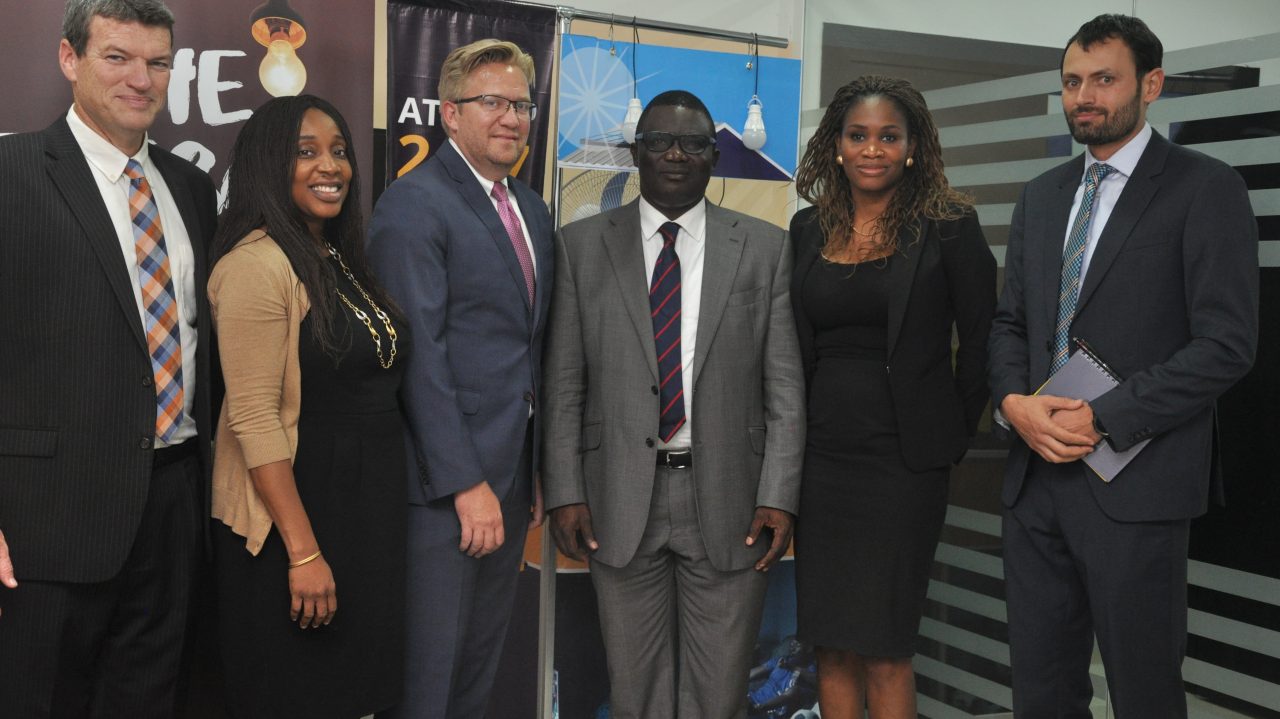 Team members of both brands pose for a picture