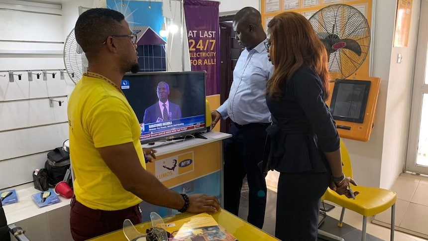 all on staff engaging with lumos nigeria agents at one of their outlets in ekiti state