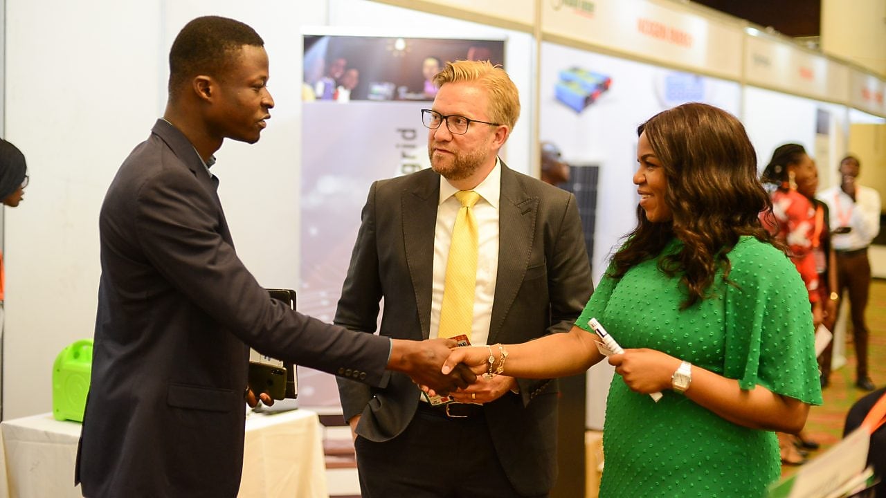 Damilola Ogunbyi and Wiebe Boer networking with a guest