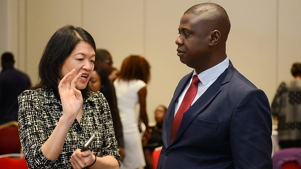 Afolabi Akinrogunde chatting with an attendee